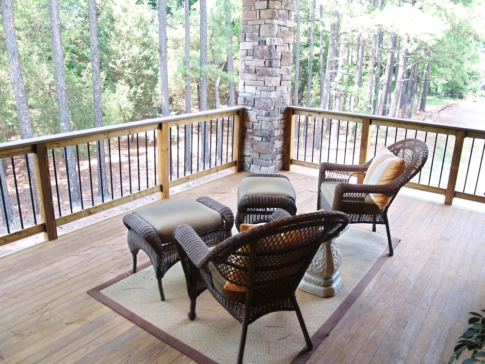 Wicker Furniture Sitting On A Wooden Deck